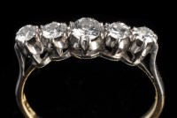 Lot 893 - A five stone diamond ring, the graduated...