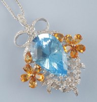 Lot 898 - A topaz and diamond pendant, the fancy...