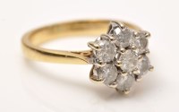 Lot 899 - A diamond cluster ring, the seven brilliant...