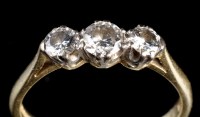 Lot 923 - A three stone diamond ring, the graduated...