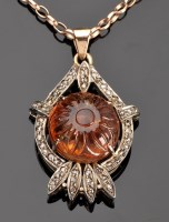 Lot 924 - An Edwardian citrine and diamond drop pendant,...