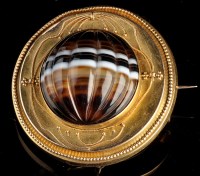 Lot 936 - A Victorian banded agate and yellow metal...