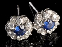 Lot 949 - A pair of sapphire and diamond cluster...