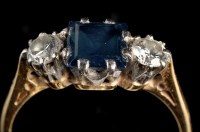 Lot 963 - A sapphire and diamond ring, the square step...