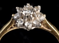 Lot 964 - A diamond cluster ring, the central brilliant...