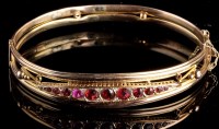 Lot 972 - A Victorian ruby and diamond set bangle, the...