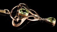 Lot 985 - An Edwardian Art Nouveau peridot and yellow...