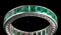 Lot 993 - An emerald eternity ring, set throughout with...