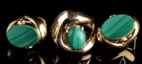 Lot 996 - A malachite and yellow metal dress ring, the...