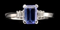 Lot 1000 - A tanzanite and diamond ring, the baguette cut...