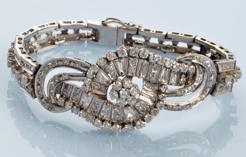 Lot 1010 - A diamond bracelet, set throughout with...