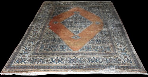 Lot 1013 - A North West Persian carpet, the central...