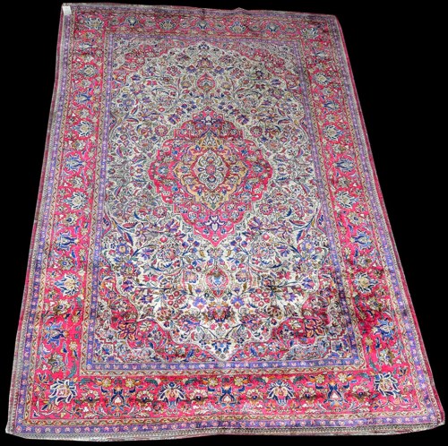 Lot 1017 - A Kashan silk rug, the central medallion and...
