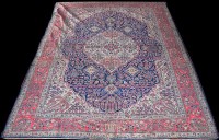 Lot 1018 - A West Persian carpet, the shaped oval central...