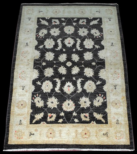 Lot 1021 - An Afghan rug, with Ziegler style leaf head...