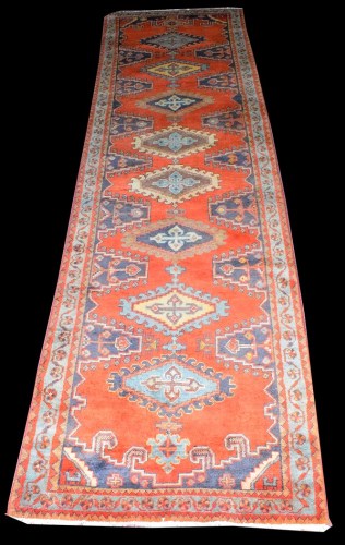Lot 1029 - A Persian runner, with eight diamond-shaped...