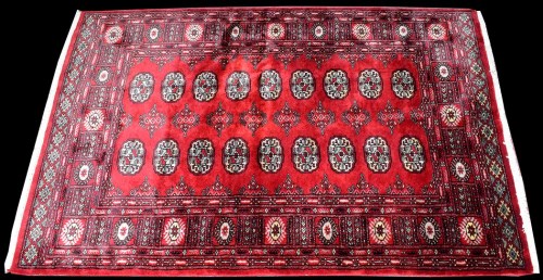 Lot 1030 - A Bokhara Turkoman style rug, with eighteen...