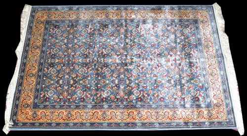 Lot 1033 - A machine woven Kashmiri rug, with floral...