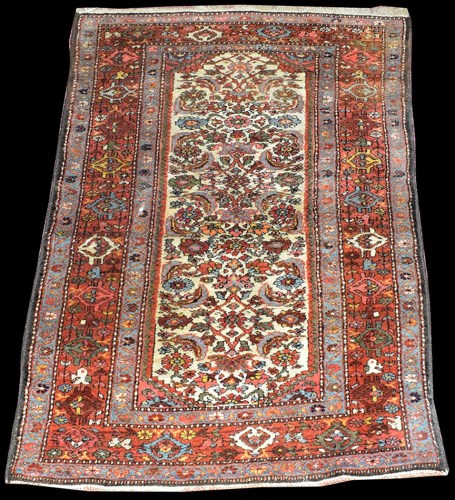 Lot 1038 - A Hamadan rug, the ivory ground decorated with...