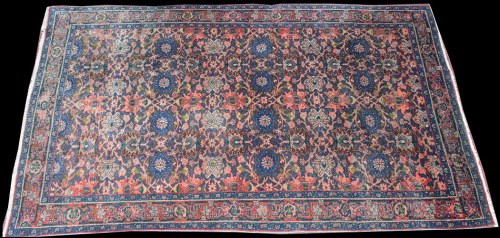Lot 1039 - A West Persian rug, the field decorated with...