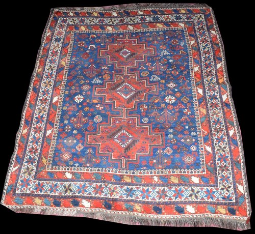 Lot 1043 - A Shiraz rug, three medallions, the field...