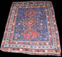Lot 1043 - A Shiraz rug, three medallions, the field...