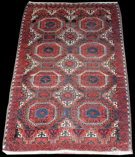 Lot 1047 - A Balouch rug, with eight teke style...
