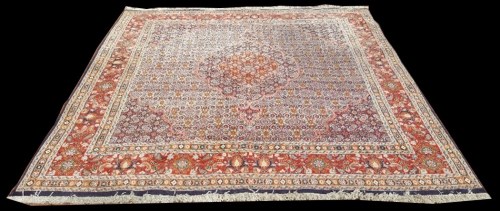 Lot 1054 - A Moud carpet, the central medallion and field...