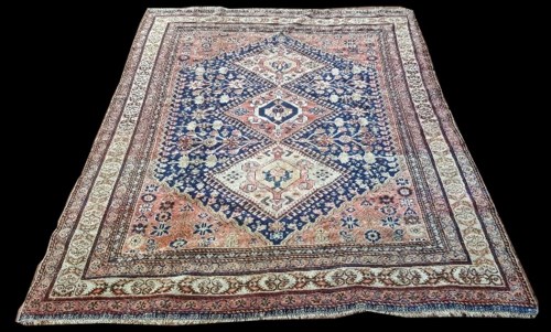 Lot 1056 - A Quashqai rug, with triple medallion design...