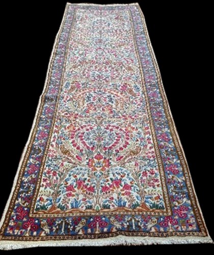 Lot 1059 - A Kirman runner, decorated throughout with...