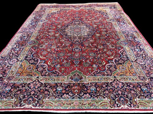 Lot 1065 - A Kashan carpet, the central diamond-shaped...