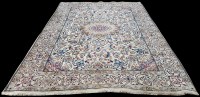 Lot 1067 - A Nain carpet, the small medallion surrounded...