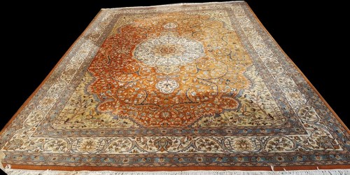 Lot 1073 - A Tabriz carpet, the central rosette medallion...