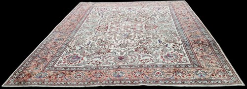 Lot 1074 - A Tabriz carpet, the ivory ground with bold...