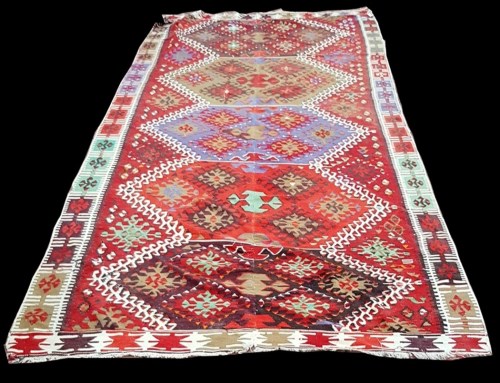 Lot 1081 - A Caucasian Kilim carpet, with bold geometric...