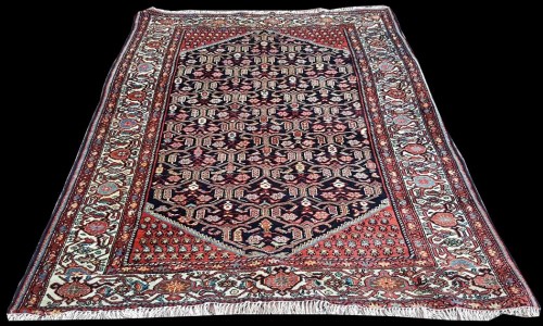 Lot 1082 - A Darjazin rug, the black ground with...
