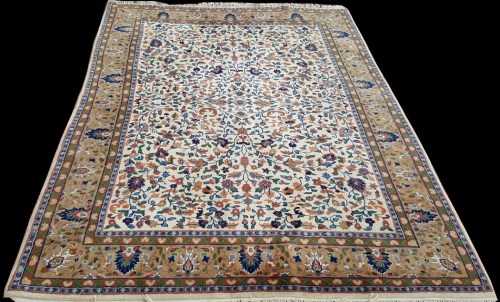 Lot 1084 - A Tabriz carpet, the ivory ground with floral...
