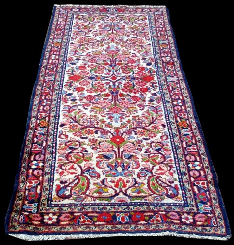 Lot 1089 - A Lilian runner, decorated with floral scrolls...