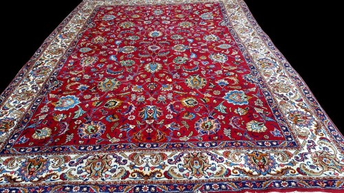 Lot 1096 - A Tabriz carpet, with full floral scrolls on a...