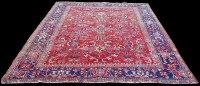 Lot 1104 - An early 20th Century Heriz carpet, with...