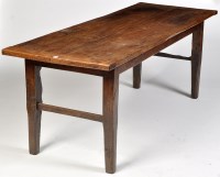 Lot 1144 - A 19th Century elm table, the plank top raised...