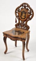 Lot 1147 - A late 19th Century Continental carved walnut...