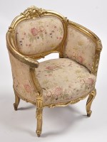 Lot 1158 - A Louis XV style carved giltwood tub chair,...