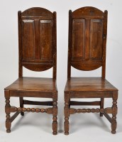 Lot 1159 - A pair of 18th Century oak chairs, each with...