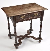 Lot 1179 - A 17th Century style carved oak low boy, the...