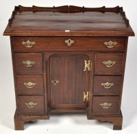 Lot 1186 - A George III mahogany kneehole desk, the...