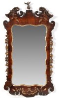 Lot 1187 - A George III parcel gilt walnut wall mirror,...