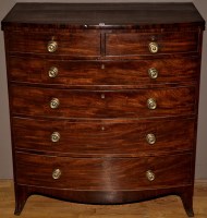 Lot 1198 - A George III mahogany bowfront chest of two...