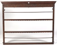 Lot 1205 - An oak delft rack, the flared cornice above...