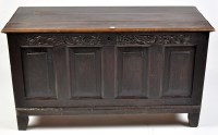 Lot 1209 - An 19th Century oak coffer, the panel front...